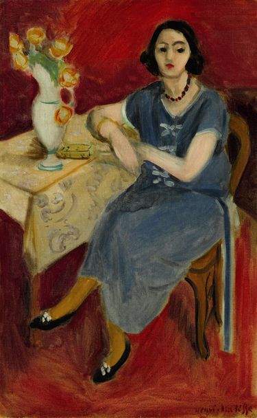 Woman in Blue at a Table, Red Background (1923) – Henri Matisse Tablo